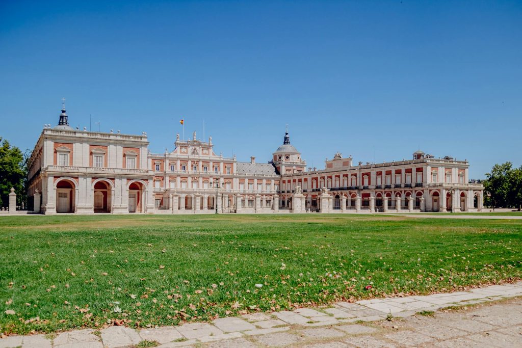 the royal palace of madrid The Royal Palace of Madrid with expansive lawns, a prime spot near the best hiking trails in Spain.