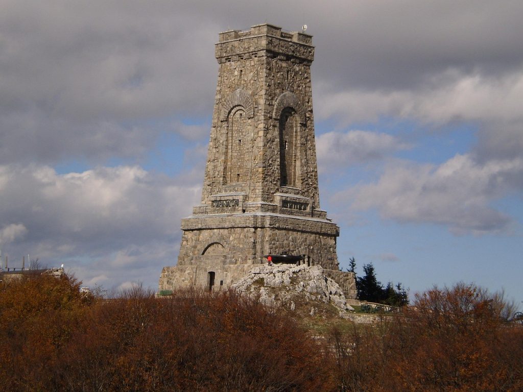 The Shipka Memorial Tower at Shipka Pass, a historic monument with scenic views of the surrounding landscape, perfect for a trekking adventure.