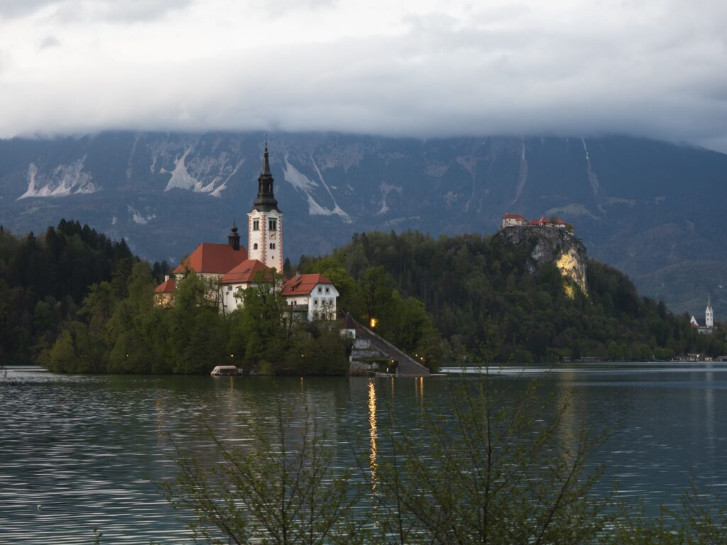 Bled Slovenia surrounded by alpine mountains, forested hills, and breathtaking natural scenery