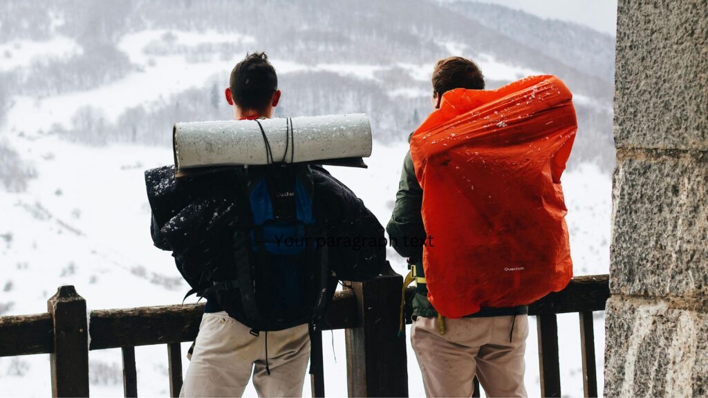 Hikers with large packs in snowy mountains, featured in a Buyers Guide Back Packs (35-50) for multi-day trekking.