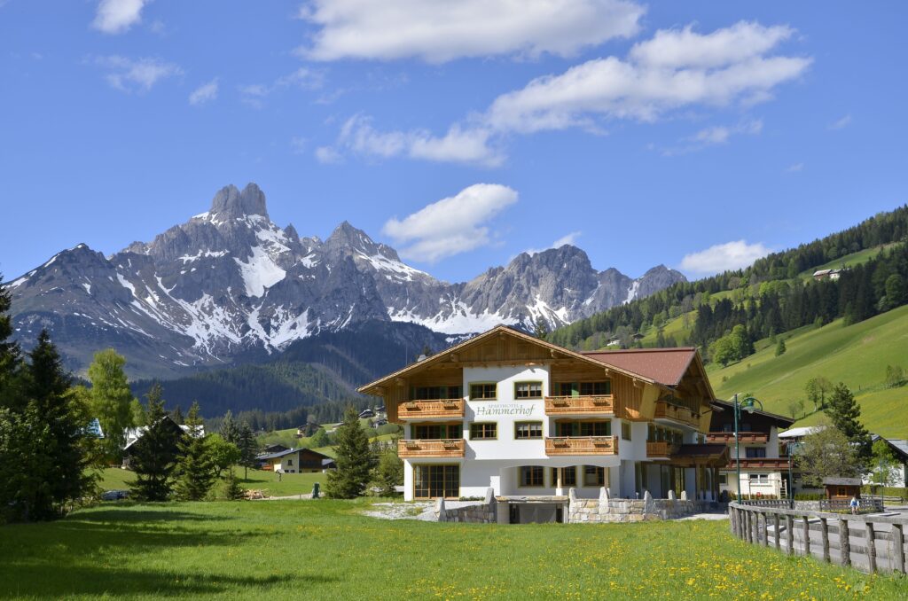 Filzmoos Austria winter hiking trail surrounded by snowy peaks, alpine meadows, and breathtaking mountain scenery.