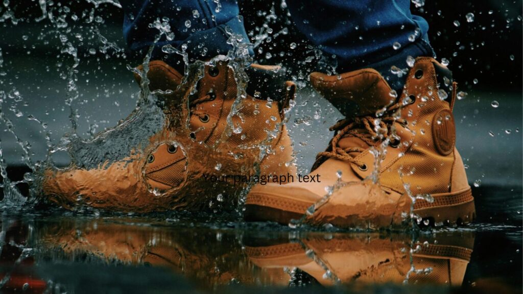 Hiking boots splashing through water on a rugged trail, showcasing waterproof protection for wet hiking conditions.