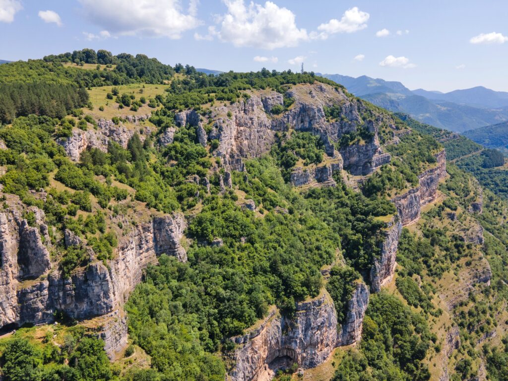Iskar Gorge to Lakatnik Cliffs with dramatic limestone cliffs, lush forests, and panoramic mountain views in Bulgaria.