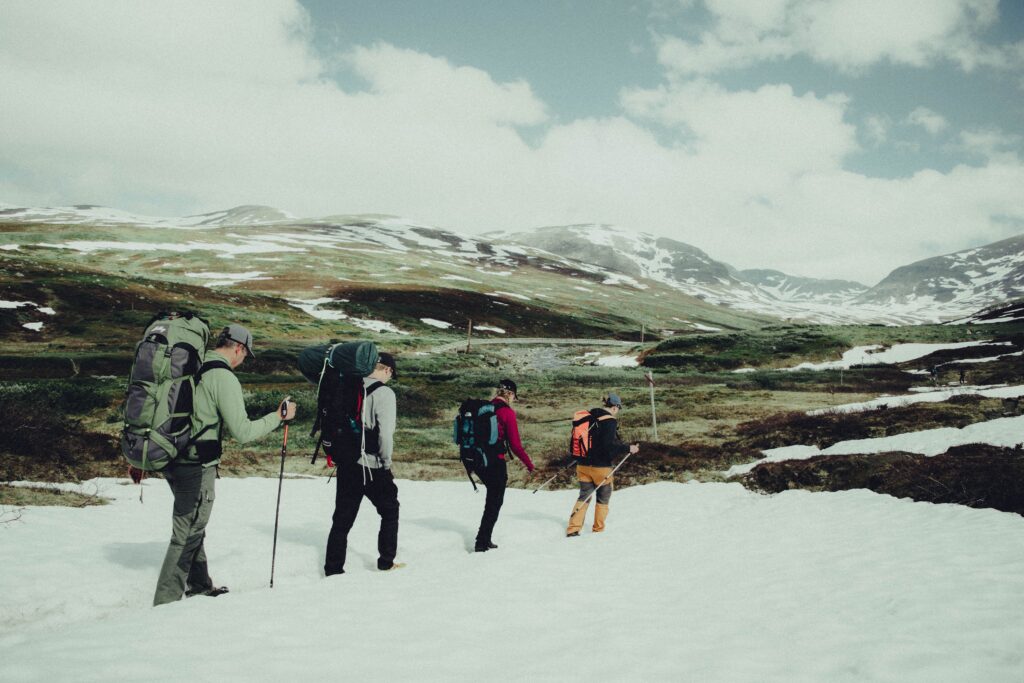 LongDistance Treks Remote Routes Kayde Parker Hikers carrying backpacks through rugged wilderness on Long Distance Treks Remote Routes adventures