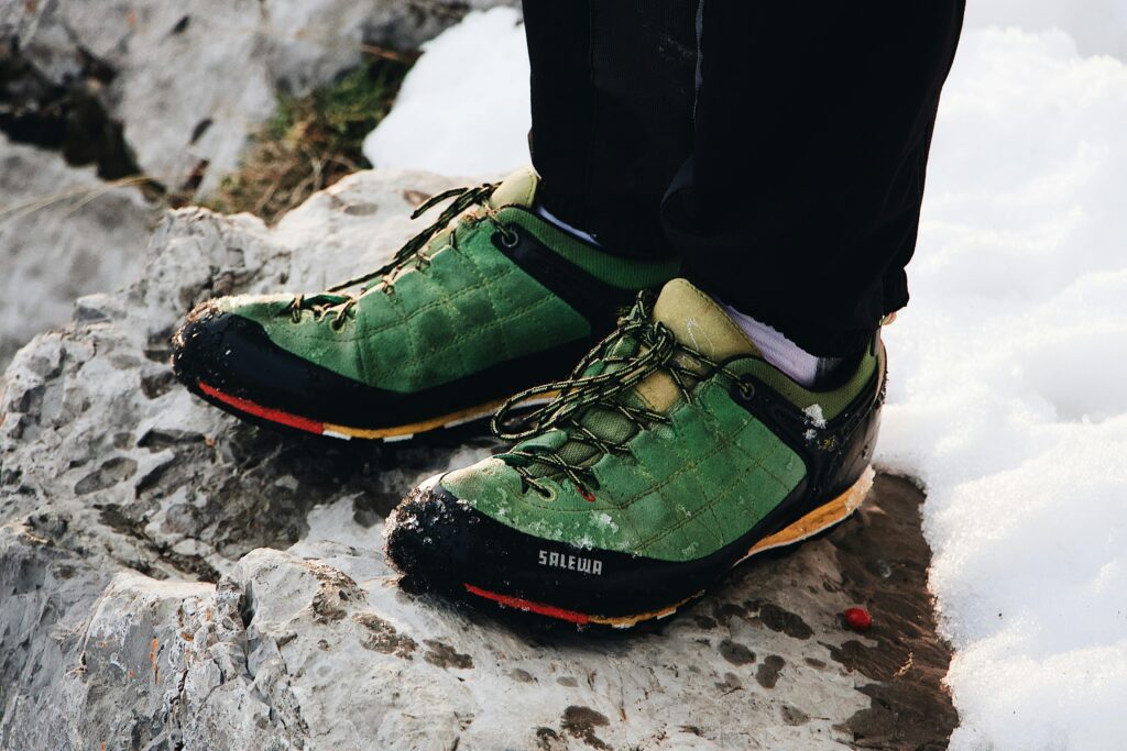 How to Choose Hiking Footwear lightweight hiking shoes on rocky snowy terrain for grip comfort and stability