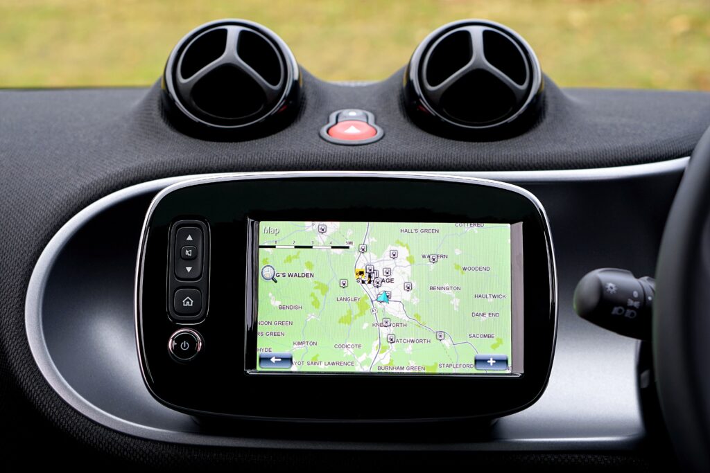 Car navigation display for Navigation & GPS Buyer’s Guide for Hiking & Walking Holidays with GPS map on dashboard.