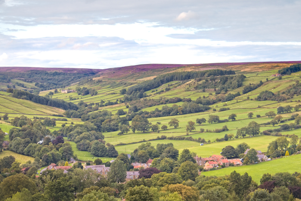Rolling moorland and village views near Rosedale Abbey Ironworks in the North York Moors National Park.