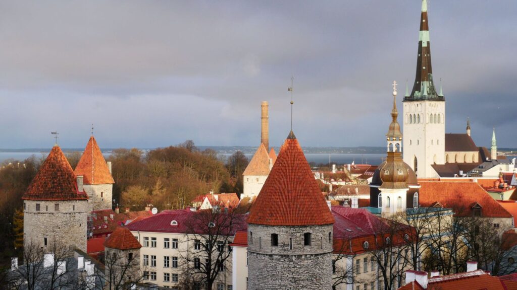 Tallinn A City Guide For Hikers featuring medieval towers red rooftops and Tallinn Old Town