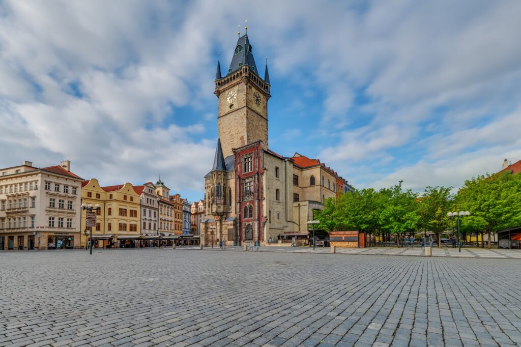 Prague Castle and St Vitus Cathedral illuminated over the city's historic rooftops.