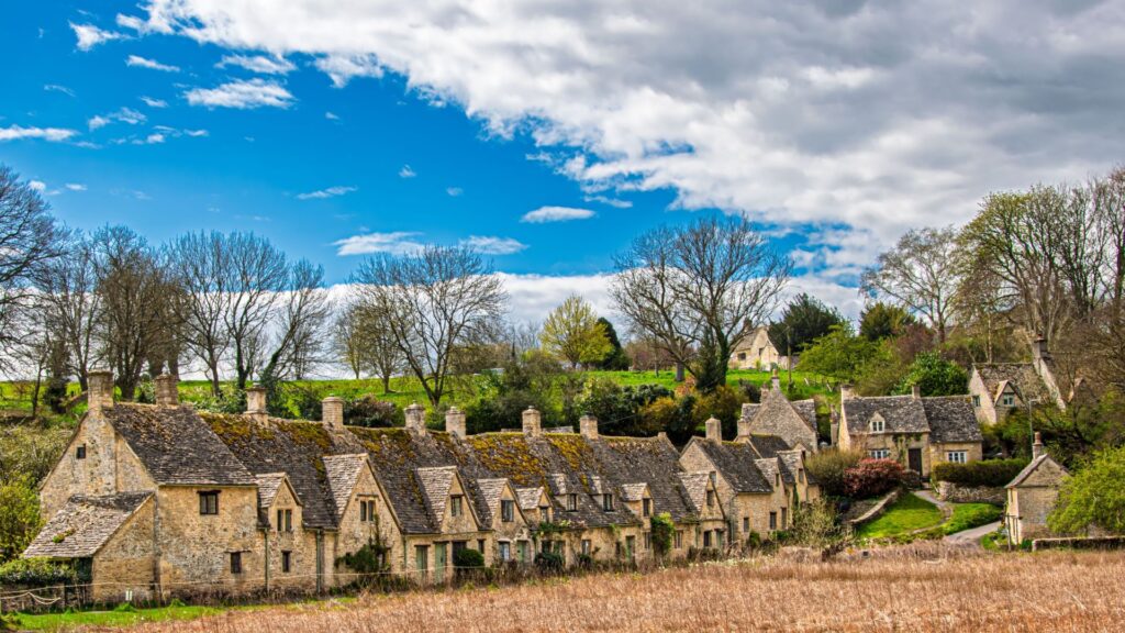 Best Hikes in the Cotswolds with a scenic view of a charming stone village and rolling countryside