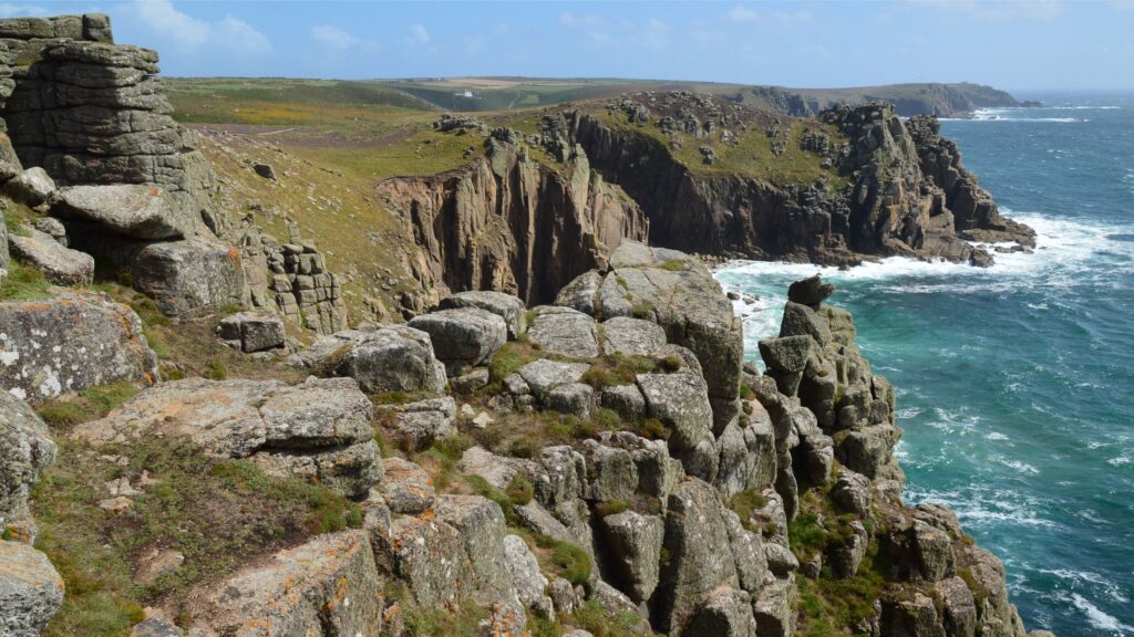 Lands End Cornwall rugged coastal cliffs rocky formations and turquoise sea coastline in England