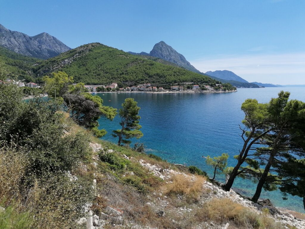 Makarska Dalmatian Croatia coastline with turquoise sea rugged mountains pine trees and coastal village