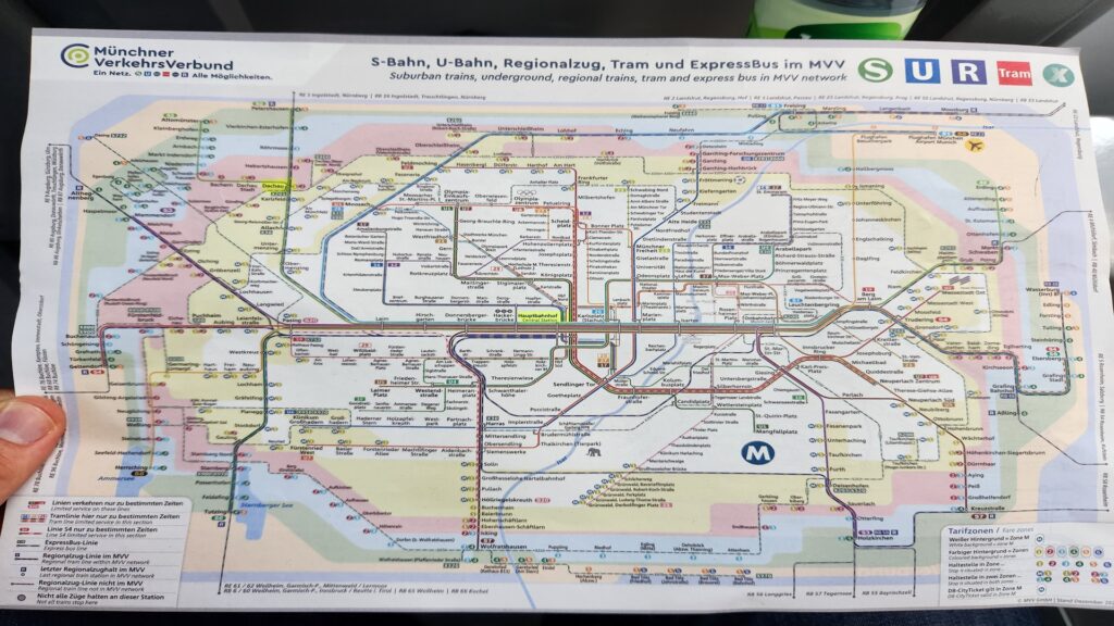 Munich Transport Map resized Kayde Parker Colorful Munich MVV transit map S Bahn U Bahn tram regional trains with logos at top left and icons on right edge showing routes and stations all over Munich area