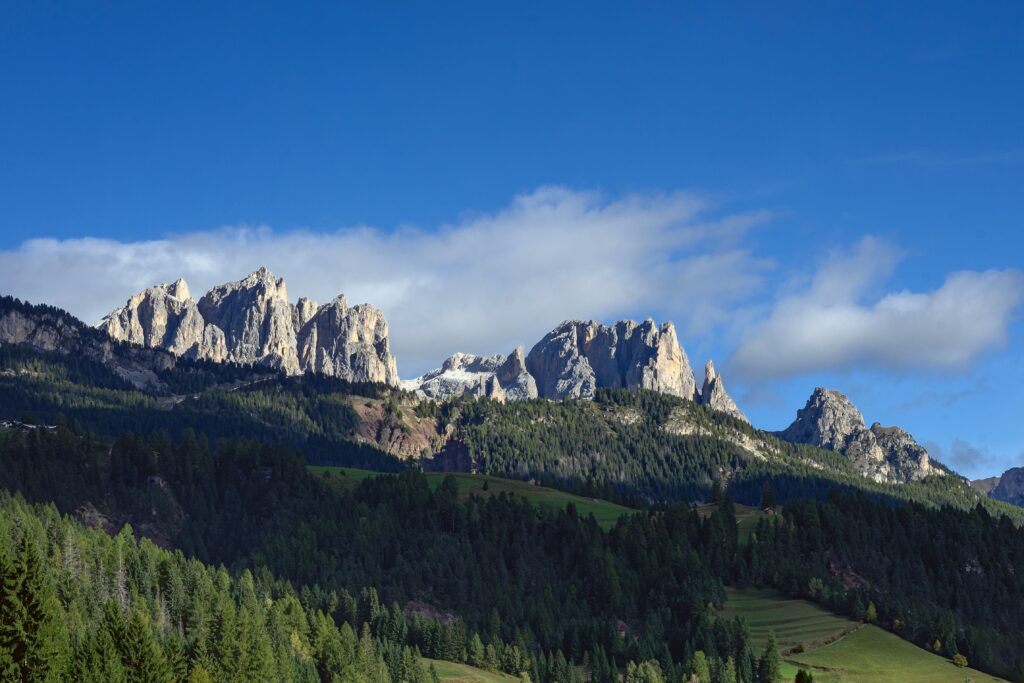 Val di Fassa nortern italy Kayde Parker Mountain landscape with dramatic Dolomites peaks forest and green valleys in Val di Fassa Italy